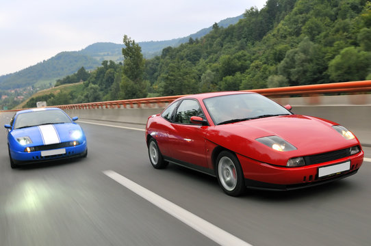 Fototapeta cars speeding on highway captured with long exposure