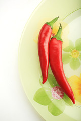 Two red hot chili peppers