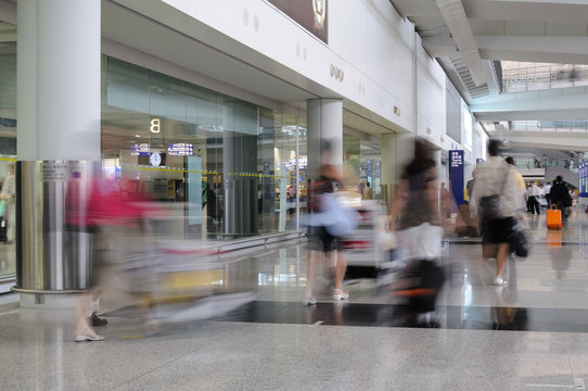 Motion blur image of people arrive in airport