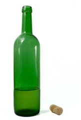 Open bottle from a green glass with a fuse on a white background