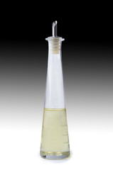 oil in a clear bottle on black and white background