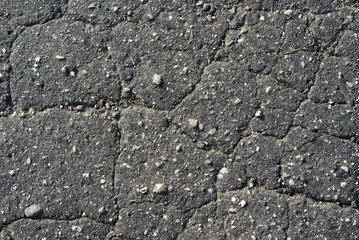 Very old asphalt - set of the cracks, damaged by weather.
