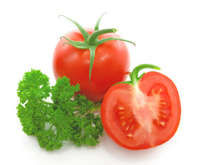 Red tomato with  parsley isolated on white background.