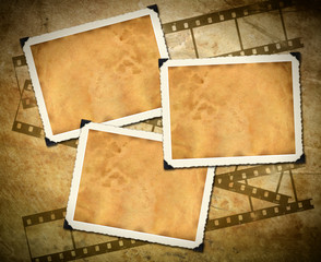 Retro photo framework against an old paper with filmstrip