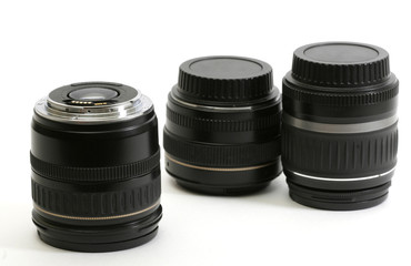 three object-glasses on white