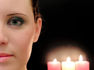 half woman face with the three candles