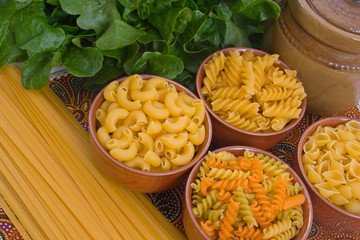 Selection of pasta  including fettuccini, shells and spirals.
