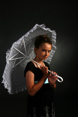 pretty young girl holding white parasol
