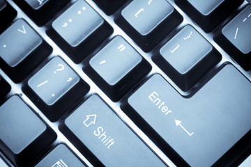 closeup macro fragment  of keyboard, blue toned