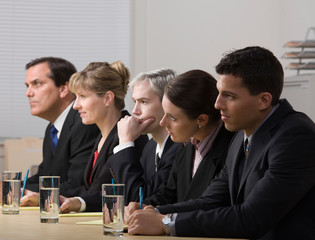 Panel of co-workers conducting a job interview