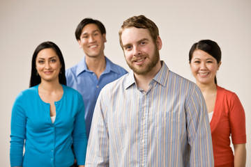 Confident man with beard posing with friends