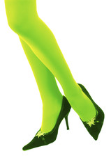 Female legs in green stockings and black shoes