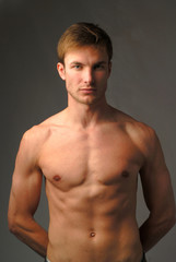 Fototapeta premium portrait young naked men which looks in chamber