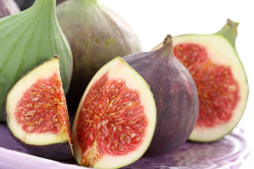 close-ups of fresh figs isolated on white - food and drink