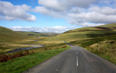 Countryside road alongside the river Elan in Wales, UK..
