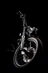 Chopper motorcycle front isolated on black