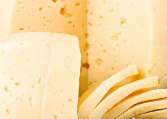 Fresh appetizing cheese on a white background