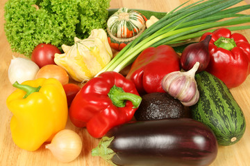 Colorful vegetables on a wooden table.