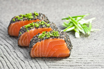 Raw salmon, pepper and wasabi. Sashimi