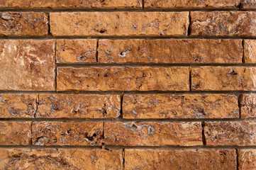 An ancient wall background made of red bricks