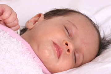 Fototapeta na wymiar cute baby girl sleeping in her bed