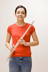 Confident musician holding flute © AVAVA