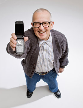 Happy, confident man displaying cell phone