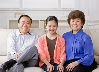 Happy grandmother, grandfather and granddaughter