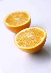 Two orange halves on a table