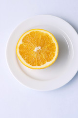Juicy orange half on a plate