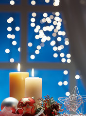 christmas decoration with bauble and candle light
