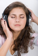 Fototapeta premium Girl is listening the music