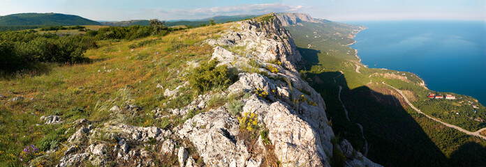 Fototapeta na wymiar View from the top of the mountain. Wide-angle panorama.