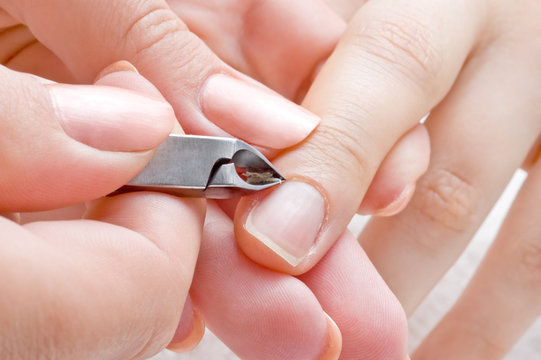 nail salon, manicure applying  - cuticle cutting