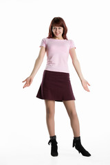 Young emotional woman in a pink shirt and red skirt