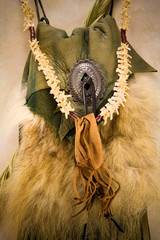 Naklejka premium A leather medecine bag and snake bone necklace with bag.