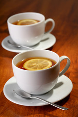 Hot teacups with lemon