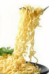 portion of spagetti in a dish on a white background