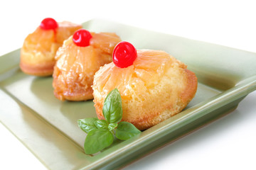 Mini Pineapple upsdie down cakes isolated on white