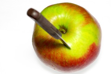 Knife in apple
