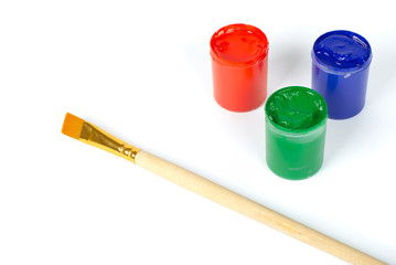 Red blue and green paints and brush