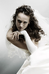 portrait of beautiful bride over grey background