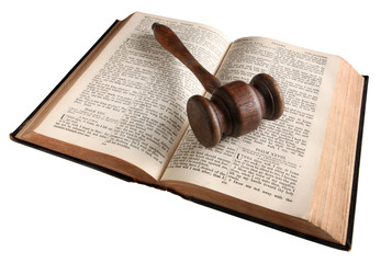A wooden judge's gavel on an 1882 bible.