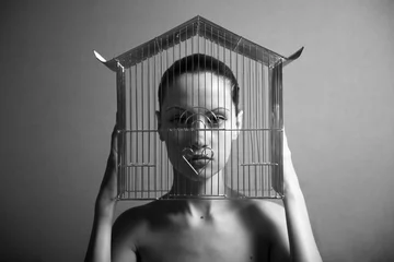 Fotobehang Surrealistic portrait of young woman with cage. © Egor Mayer