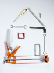 Construction tools in shape of house