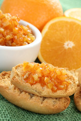 Fototapeta na wymiar delicious breakfast - hot toast and orange jam