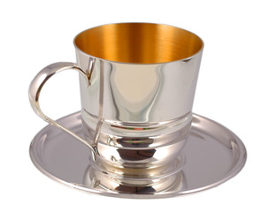 Silver cup on saucer