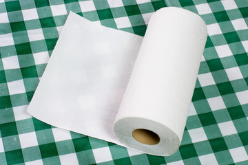 Roll of paper towel on tabletop.