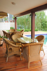old-fashioned cane chairs and table in the garden