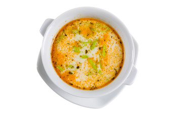 soup with green spice in white bowl